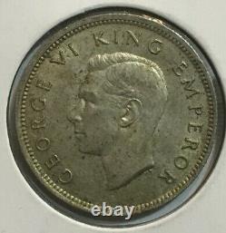 Broken Back variety New Zealand Shilling 1942 Uncirculated original surfaces