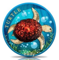 Pièce en argent colorisée de 1 oz représentant une tortue de Nouvelle-Zélande, couleur bleue spatiale, avec boîte et certificat d'authenticité.