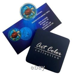 Pièce en argent colorisée de 1 oz représentant une tortue de Nouvelle-Zélande, couleur bleue spatiale, avec boîte et certificat d'authenticité.